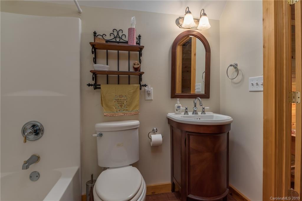 83 Cross Ridge Drive Rutherfordton, NC 28139 - Photo 25 of 38 a bathroom with a sink a toilet and shower