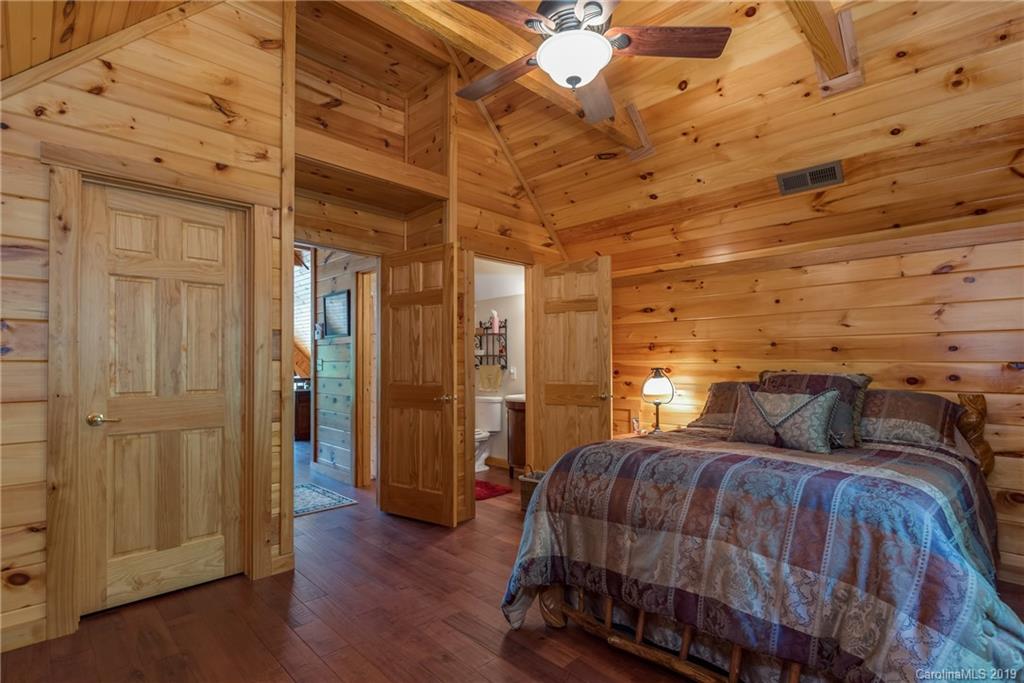 83 Cross Ridge Drive Rutherfordton, NC 28139 - Photo 26 of 38 a bedroom with a bed and wooden floor