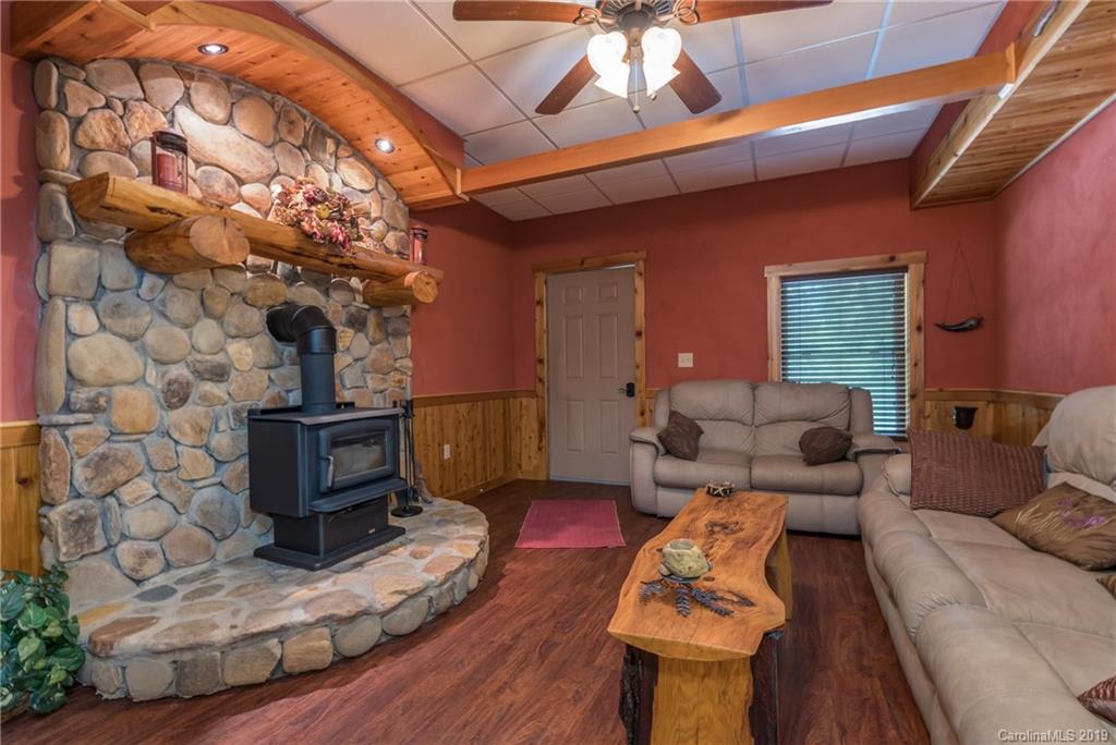 83 Cross Ridge Drive Rutherfordton, NC 28139 - Photo 27 of 38 a living room with furniture and a fireplace