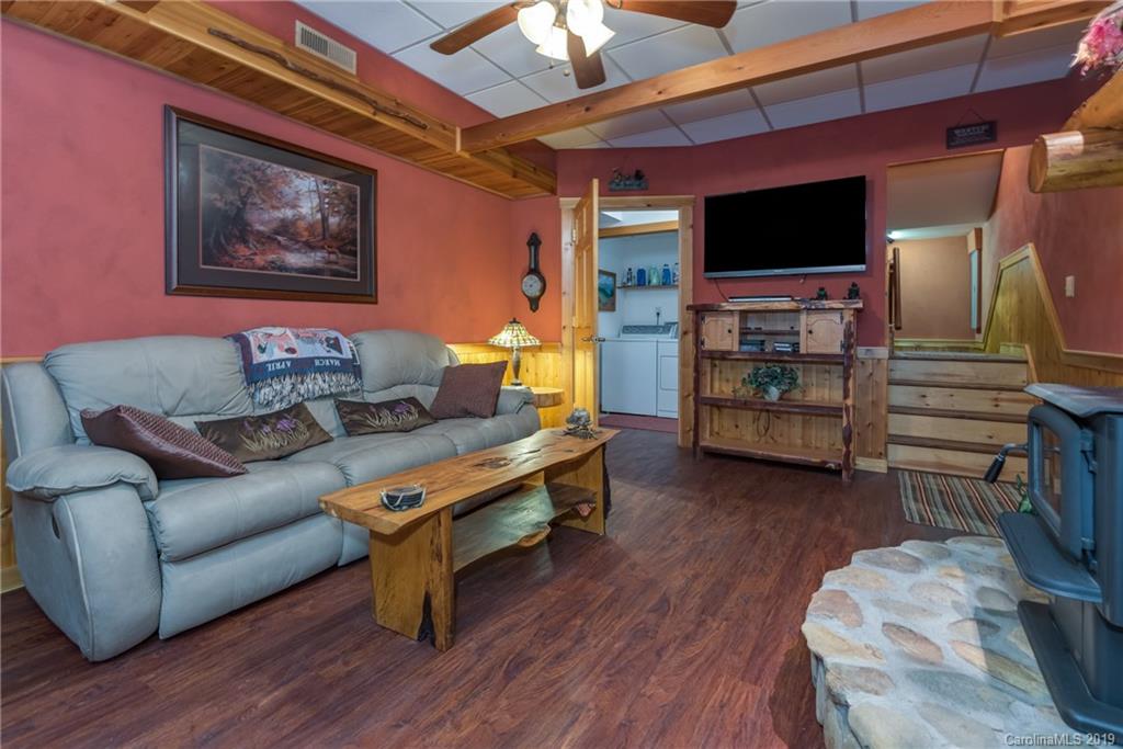 83 Cross Ridge Drive Rutherfordton, NC 28139 - Photo 30 of 38 a living room with furniture and a flat screen tv