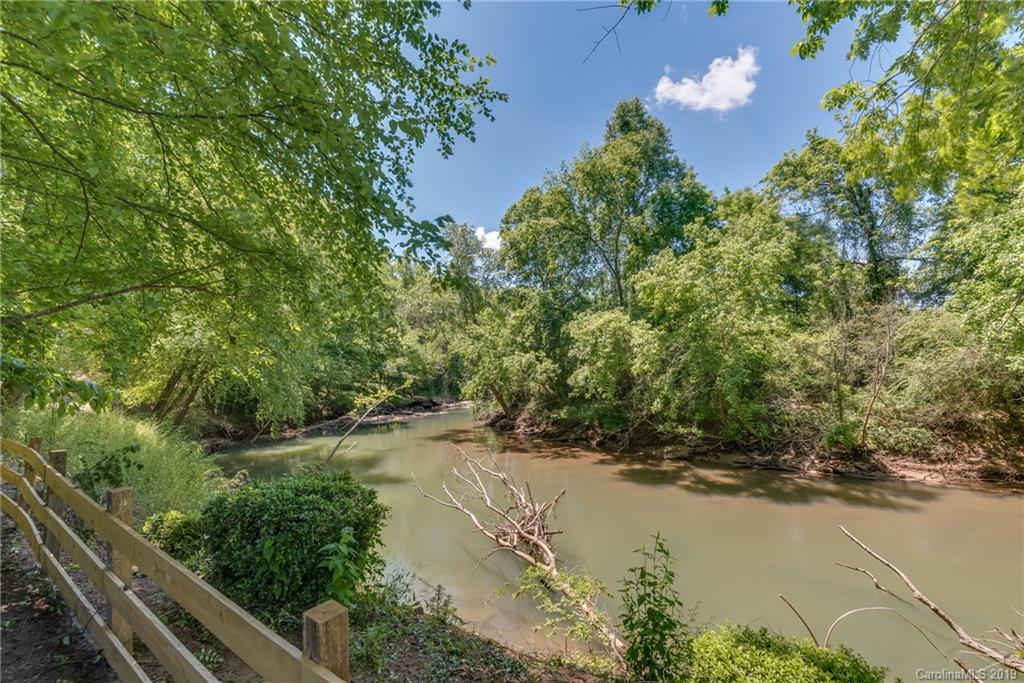 83 Cross Ridge Drive Rutherfordton, NC 28139 - Photo 8 of 38 a view of a lake with a yard and trees