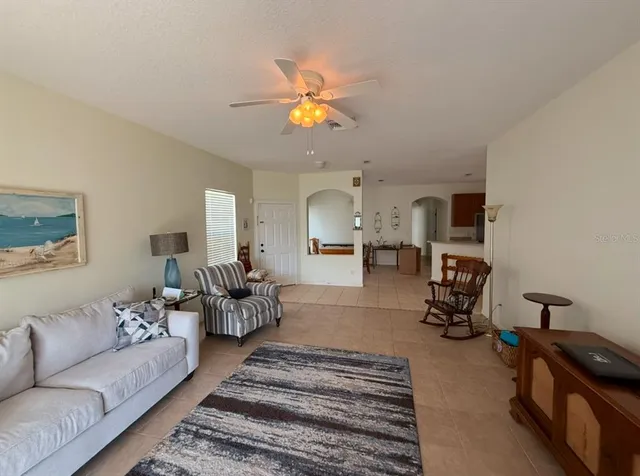 a view of an empty room with a floor to ceiling window