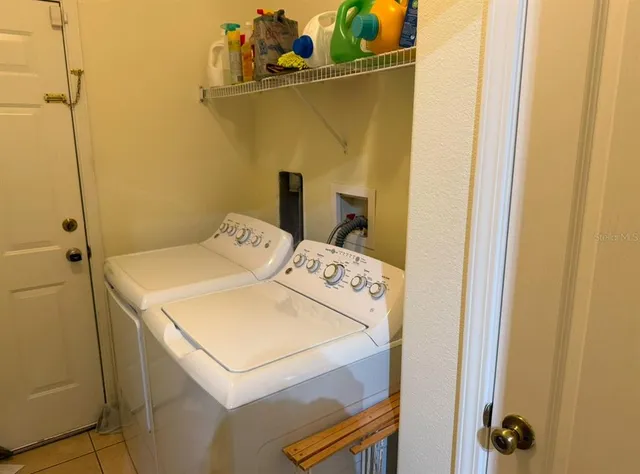 a utility room with dryer and washer