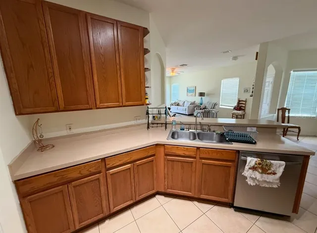 a kitchen with a sink and cabinets
