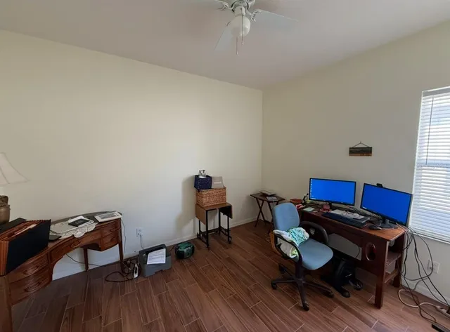 a room with furniture and wooden floor