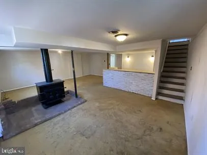 a room with furniture and stairs