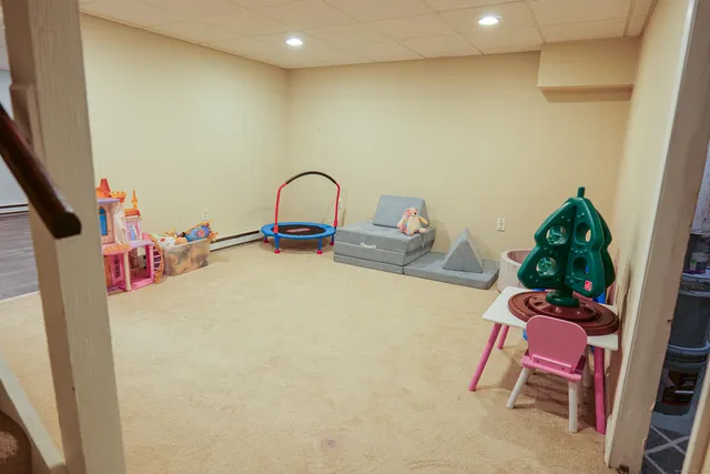 a view of livingroom with furniture and toys