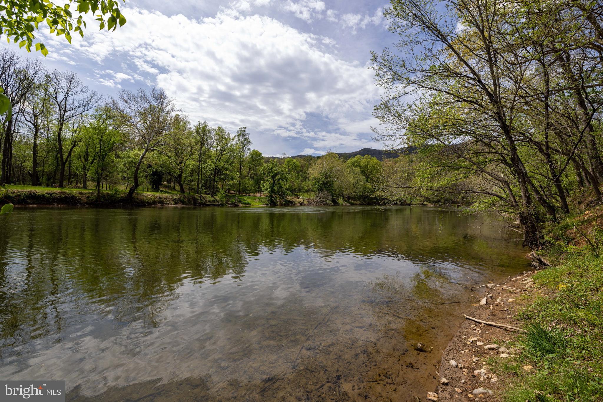 789 Mill Run Road Shenandoah, VA 22849 - Photo 34 of 76 a view of a lake with houses in the back