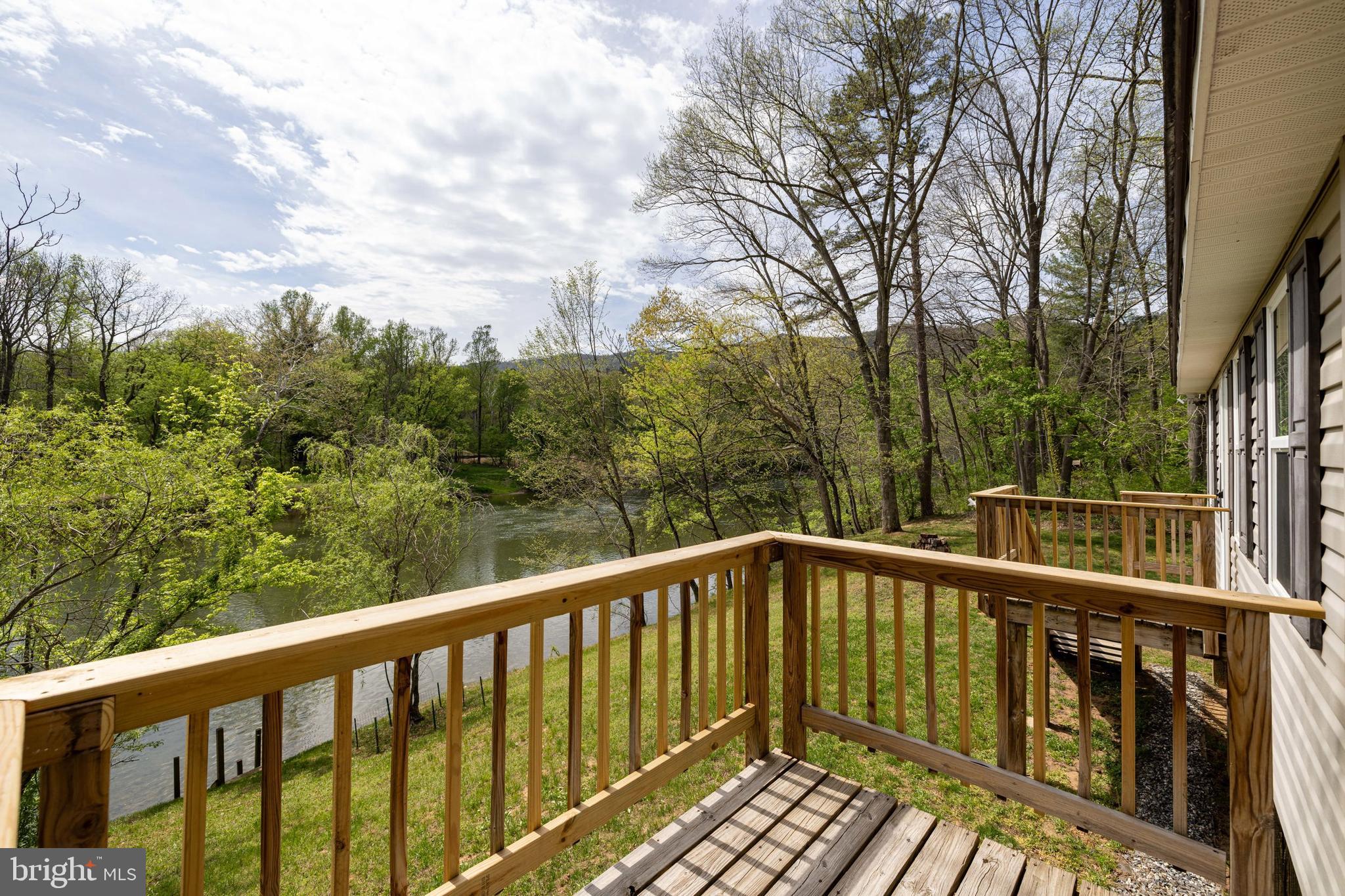 789 Mill Run Road Shenandoah, VA 22849 - Photo 5 of 76 a view of a balcony with wooden floor and fence