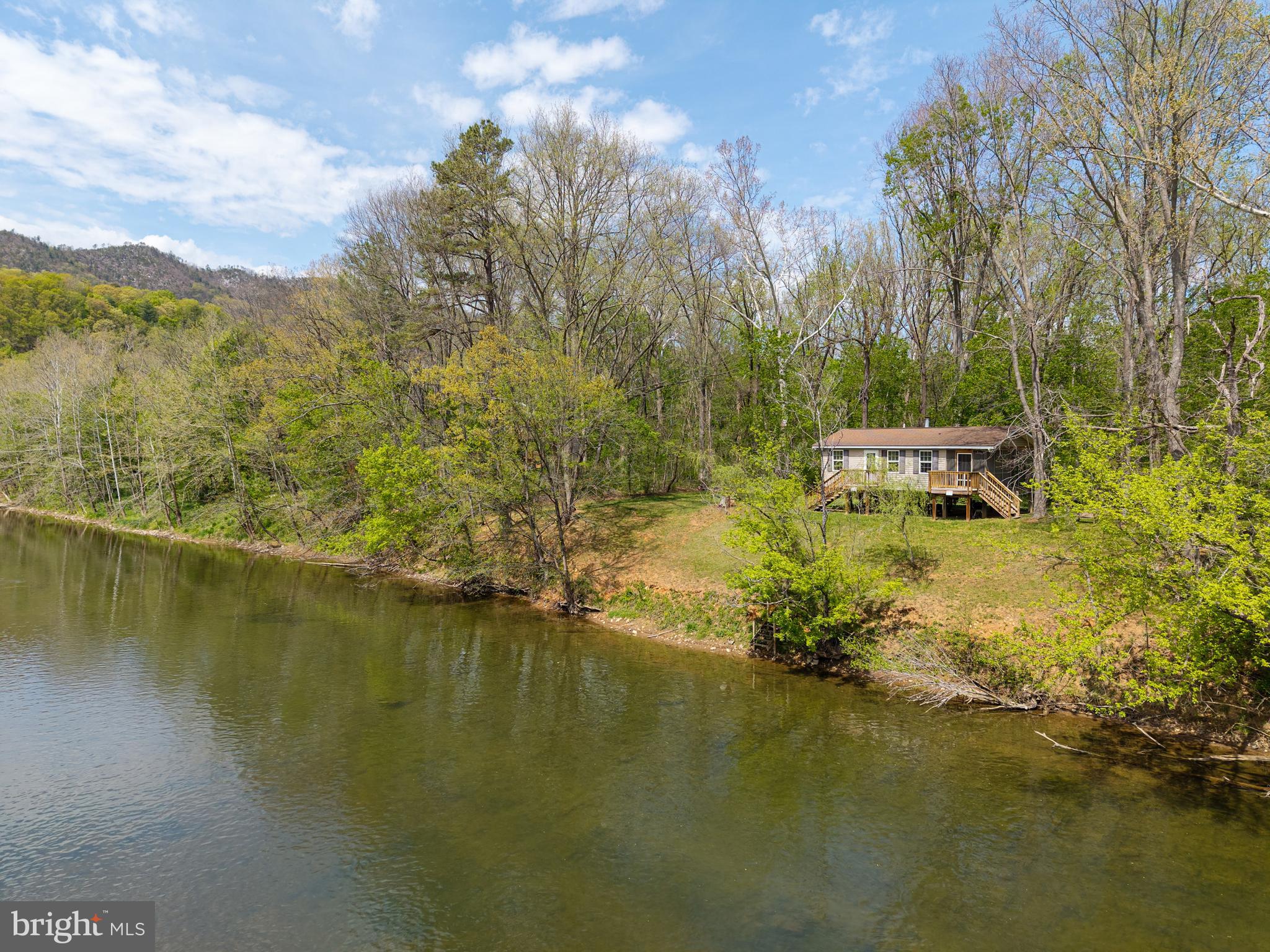 789 Mill Run Road Shenandoah, VA 22849 - Photo 53 of 76 a view of a lake with a mountain
