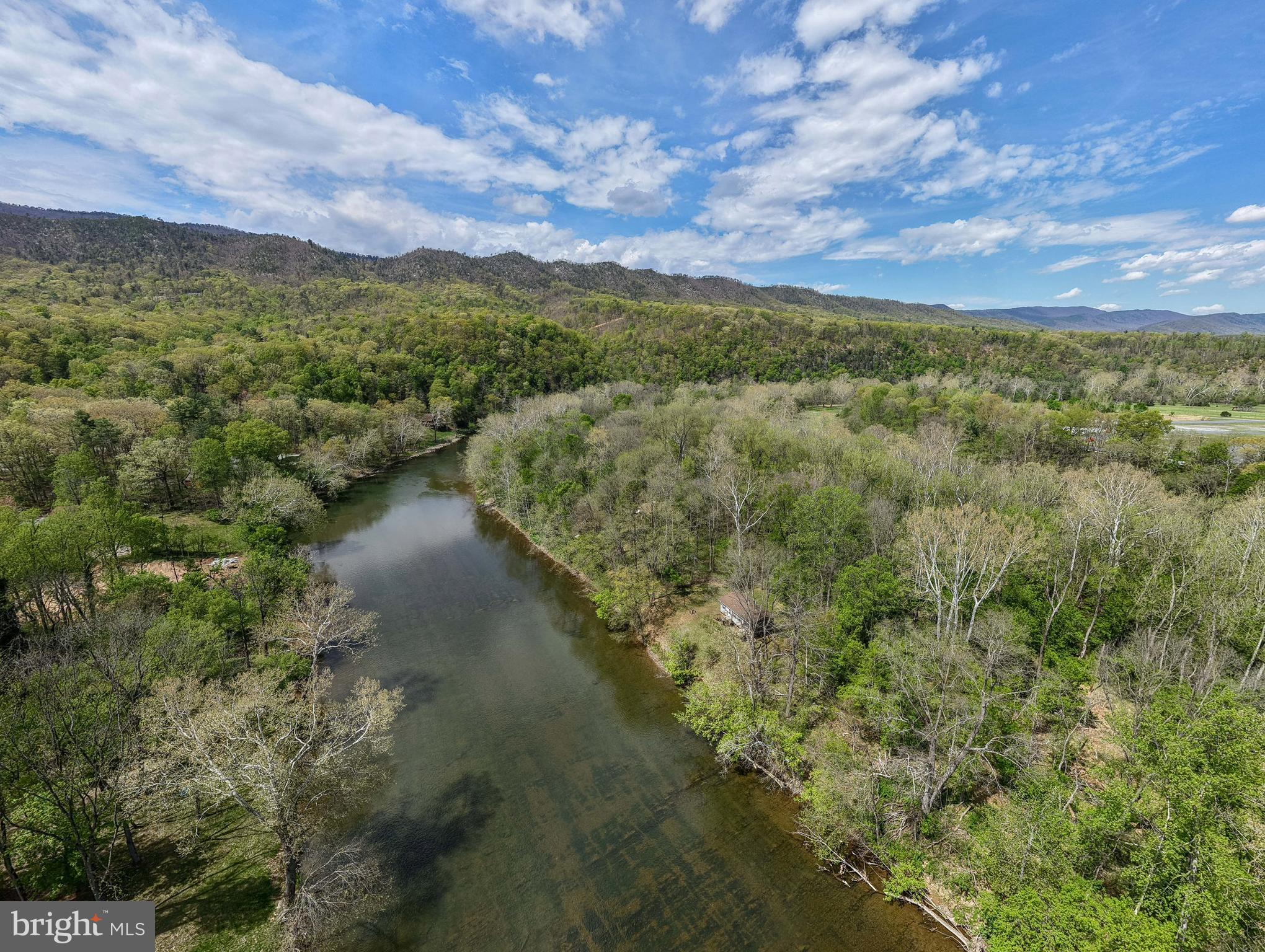 789 Mill Run Road Shenandoah, VA 22849 - Photo 59 of 76 a view of a lake with a mountain in the background