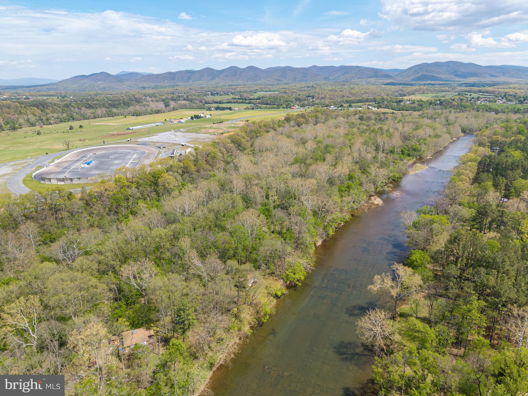 789 Mill Run Road Shenandoah, VA 22849 - Photo 62 of 76 a view of a lake with mountains in the background