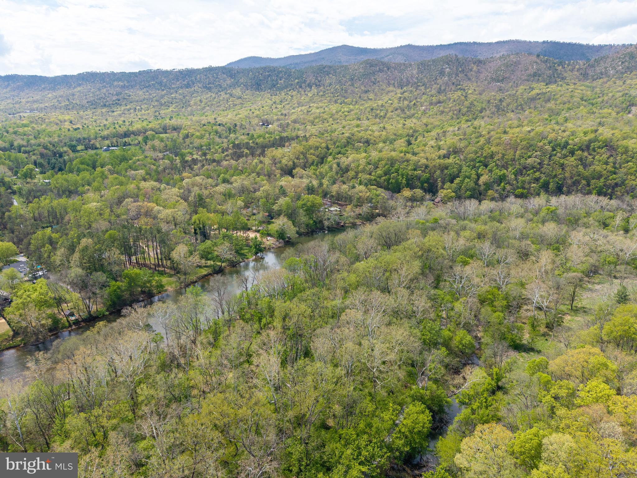 789 Mill Run Road Shenandoah, VA 22849 - Photo 76 of 76 a view of a lush green hillside and a houses