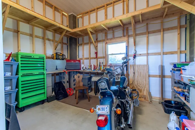 an aerial view of a house with a ocean view