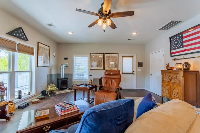 a living room with furniture fireplace and flat screen tv