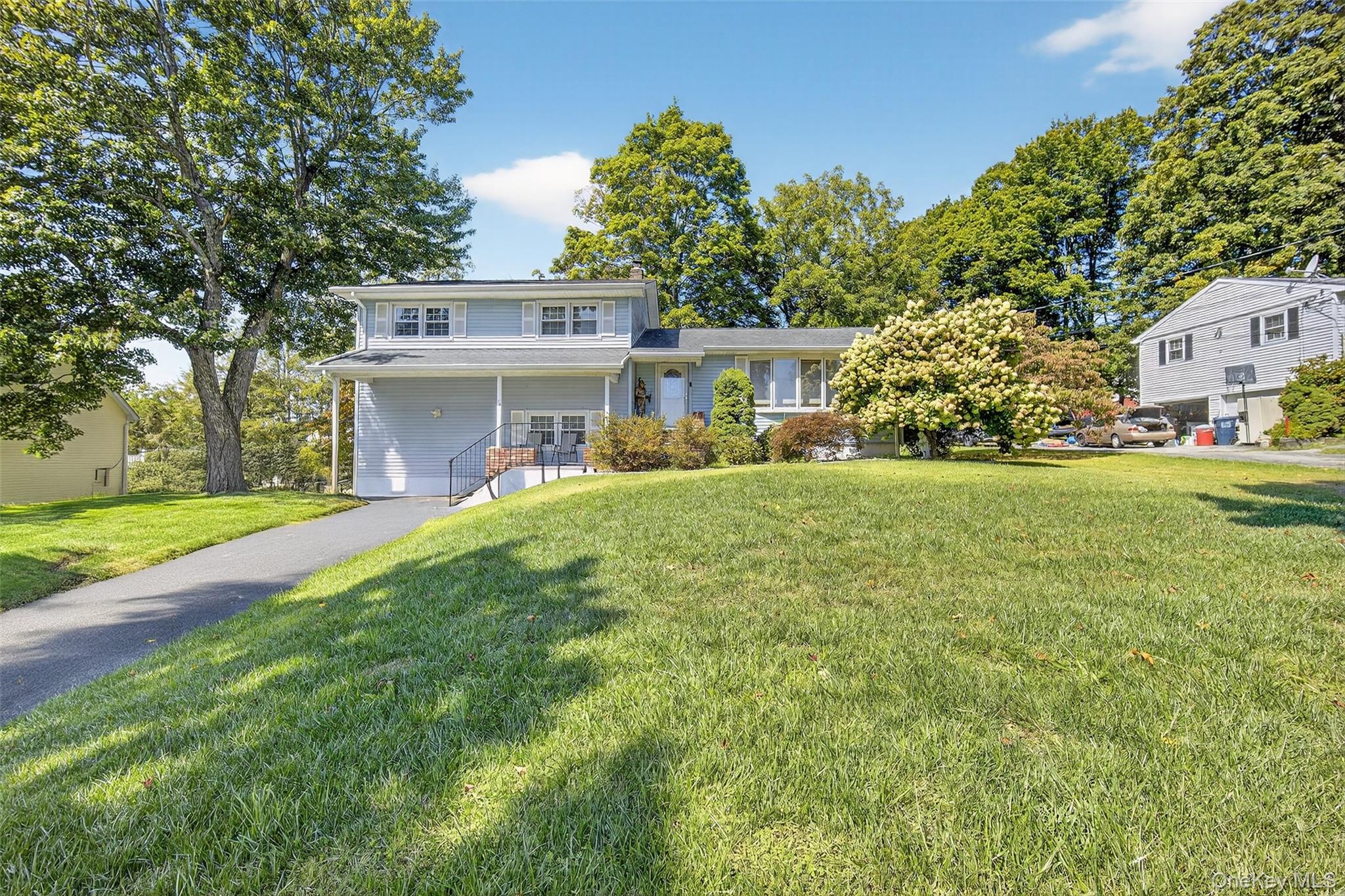 24 Fairview Road Mahopac, NY 10541 - Photo 22 of 26 a view of a house with a yard and sitting area