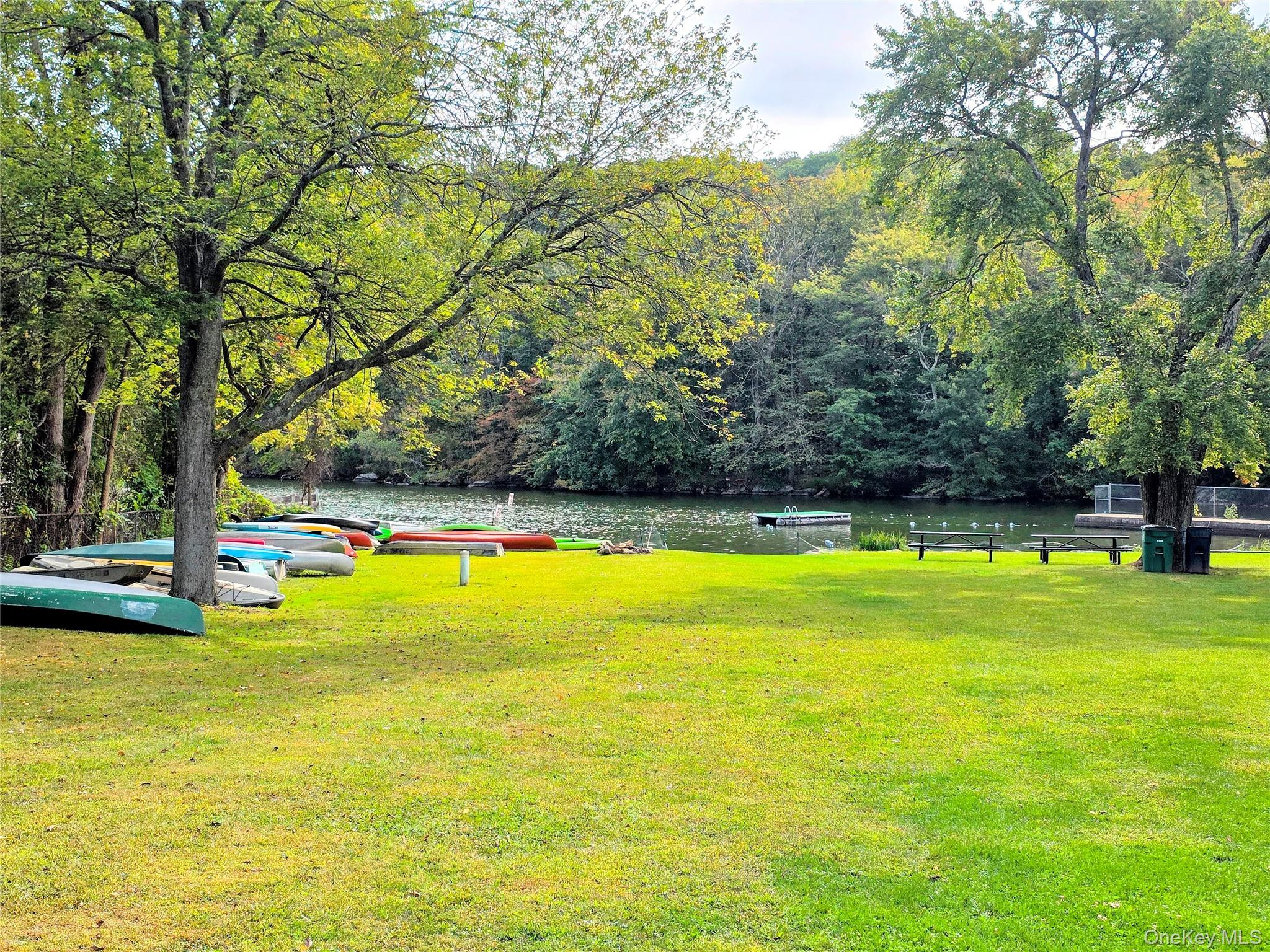 24 Fairview Road Mahopac, NY 10541 - Photo 24 of 26 a view of a swimming pool with an outdoor space and seating area