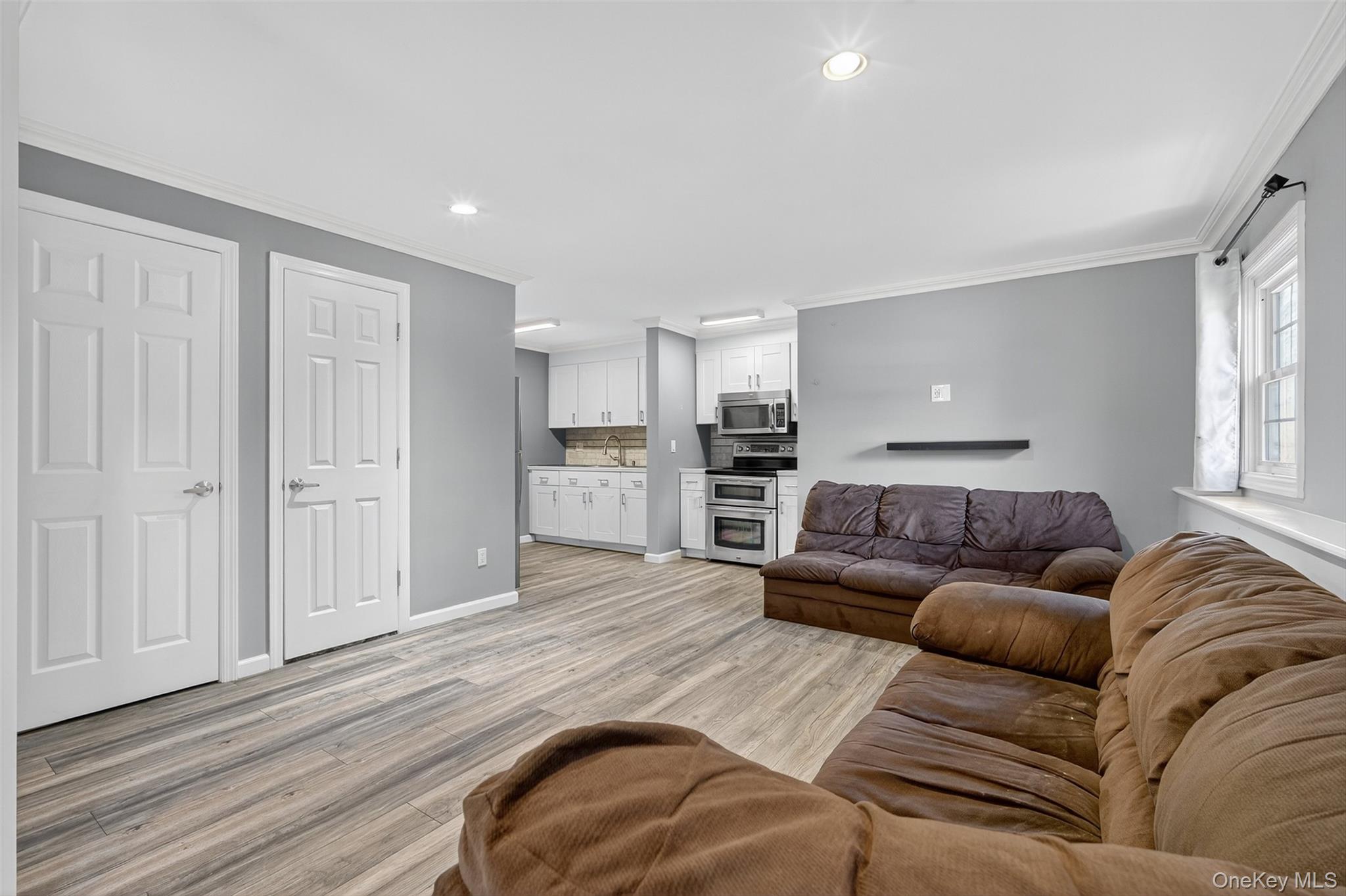 24 Fairview Road Mahopac, NY 10541 - Photo 7 of 26 a living room with furniture and kitchen view