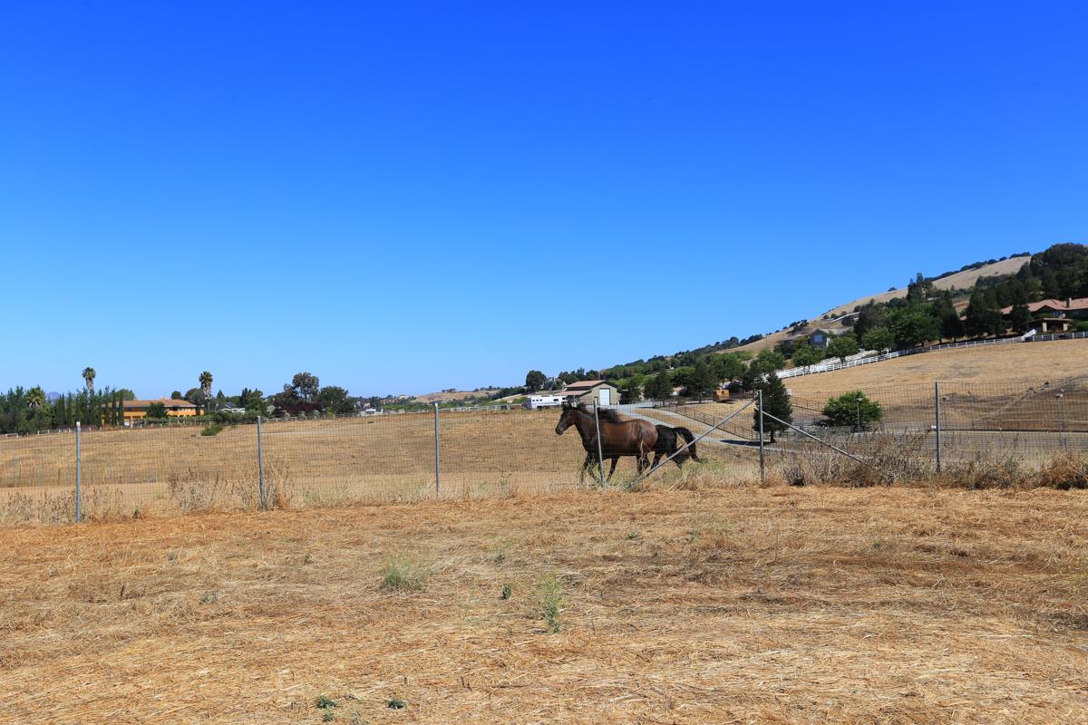3245 Roop Road Gilroy, CA 95020 - Photo 13 of 35 a view of ocean with boats and trees in the background