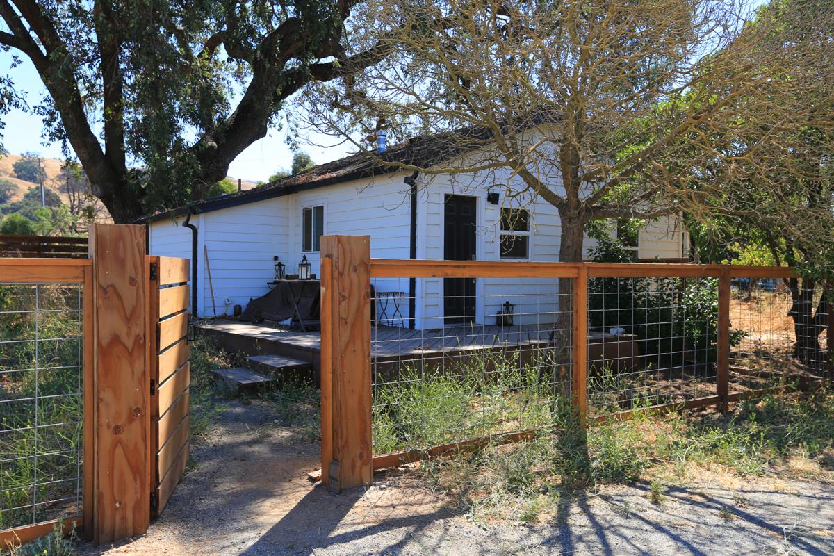 3245 Roop Road Gilroy, CA 95020 - Photo 15 of 35 a front view of a house with a yard