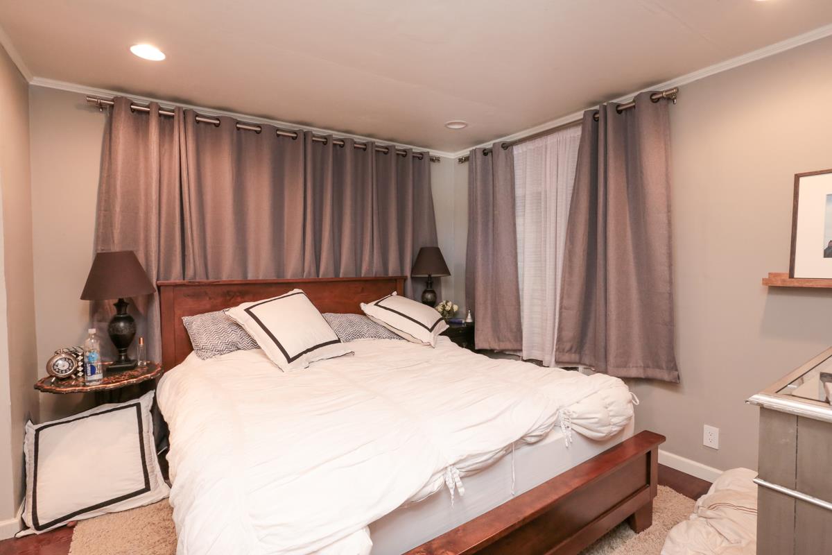 3245 Roop Road Gilroy, CA 95020 - Photo 20 of 35 a bedroom with a bed and a dresser