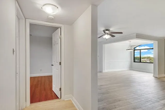 a bathroom with a granite countertop toilet a sink and shower