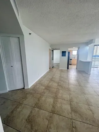 a view of a livingroom with an empty space and window