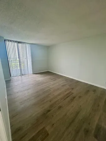 a view of empty room with windows