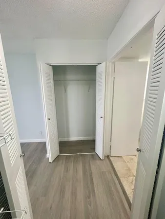 a view of a bathroom with a sink and mirror