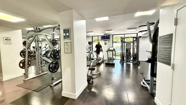 a view of a hallway with seating space