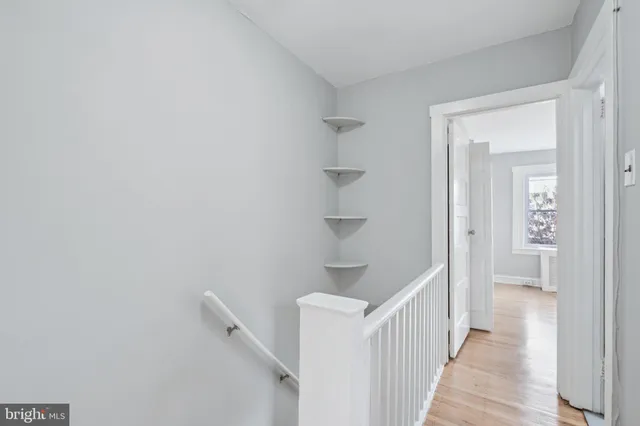 a view of a hallway with white walls