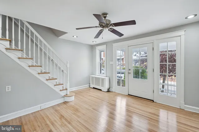 a view of an entryway with wooden floor