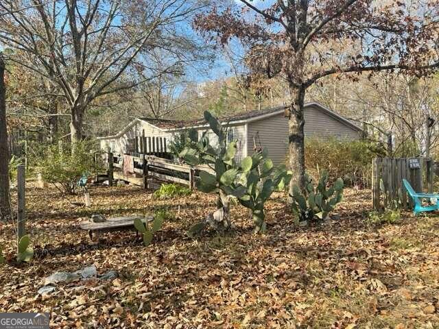 1456 Old Macon Road Gordon, GA 31031 - Photo 1 of 1 a view of a house with a yard