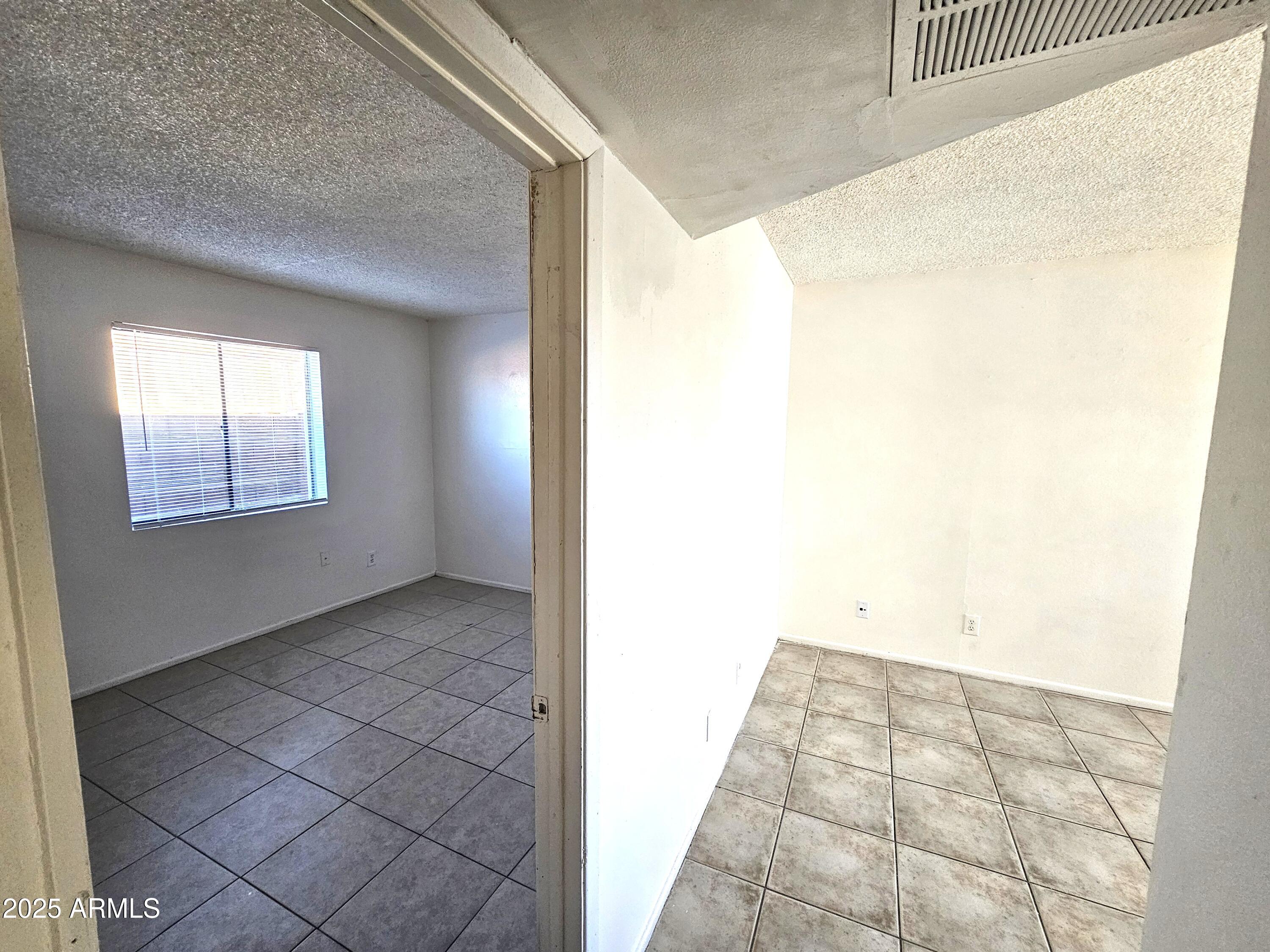45 North Lyn Rae Drive, Unit 12 Mesa, AZ 85213 - Photo 15 of 24 a view of an empty room and window