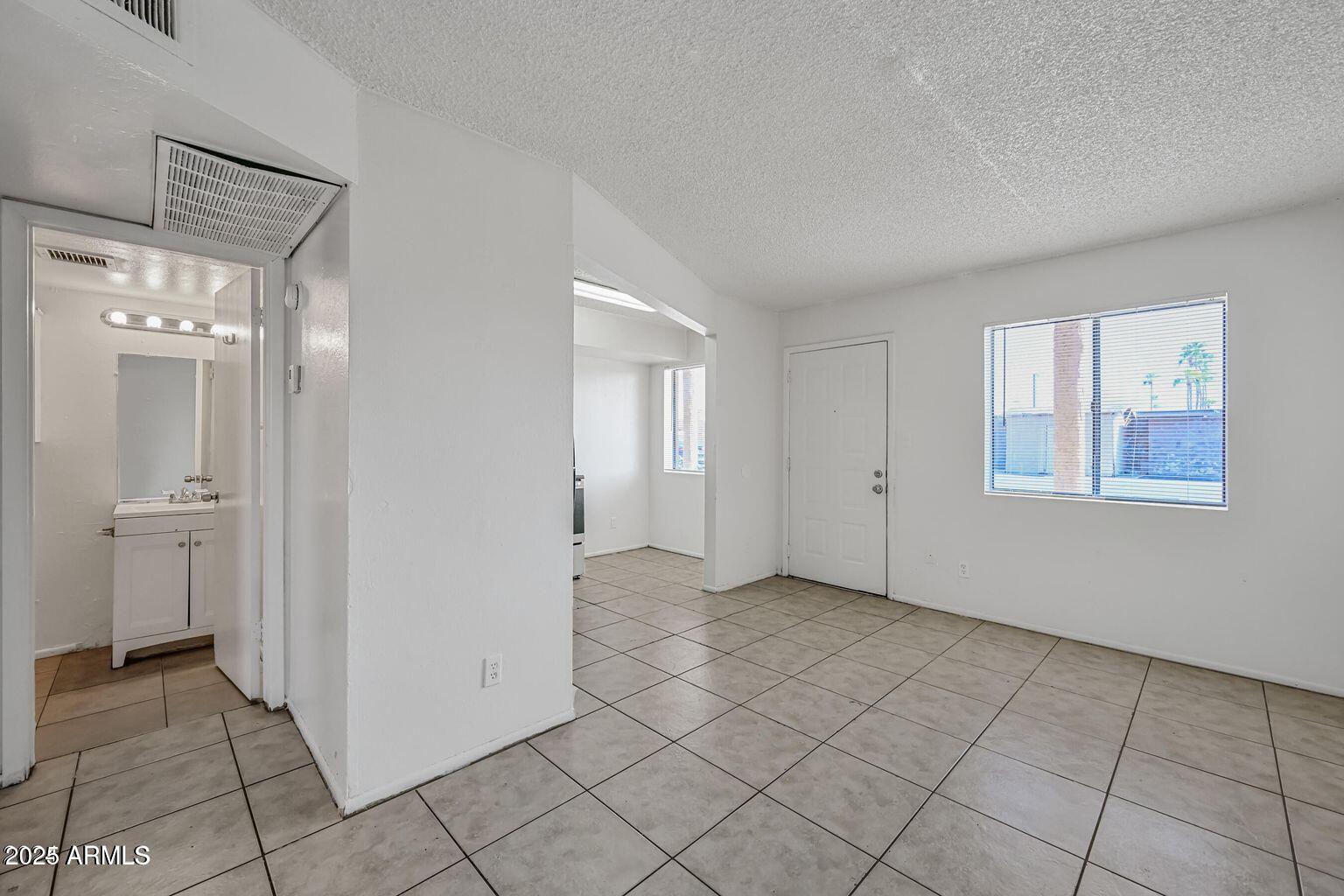 45 North Lyn Rae Drive, Unit 12 Mesa, AZ 85213 - Photo 17 of 24 a view of an empty room and window