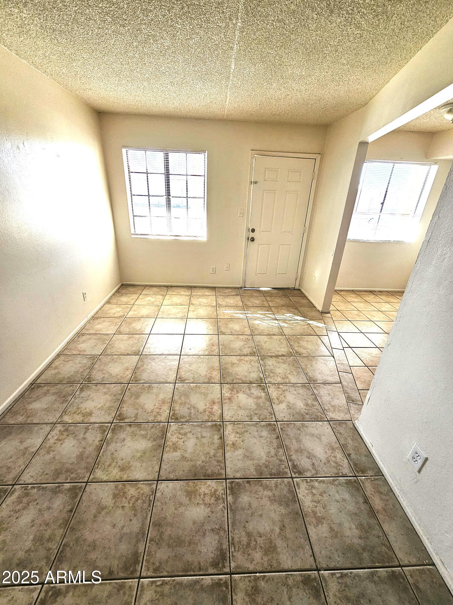 45 North Lyn Rae Drive, Unit 12 Mesa, AZ 85213 - Photo 6 of 24 a view of an empty room and window