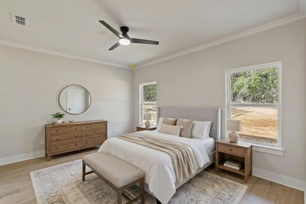 335 Perdanales Bullard, TX 75757 - Photo 21 of 37 a bedroom with a bed a window and a chandelier