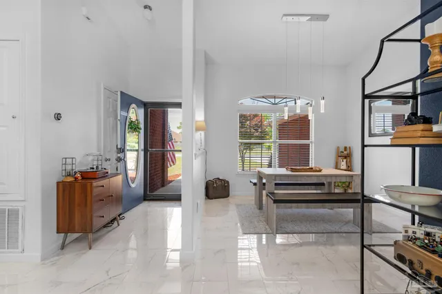 a view of a livingroom with furniture and windows
