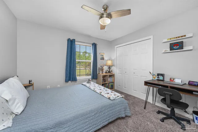 a bathroom with a sink a toilet and shower curtain