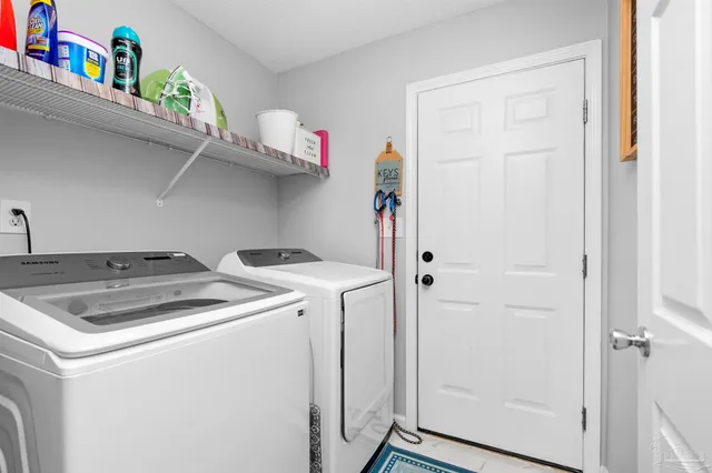a bedroom with bed and a chandelier