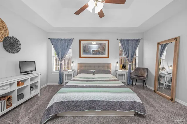 a bed room with a bed and a chandelier