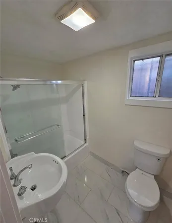 a bathroom with a toilet and a sink