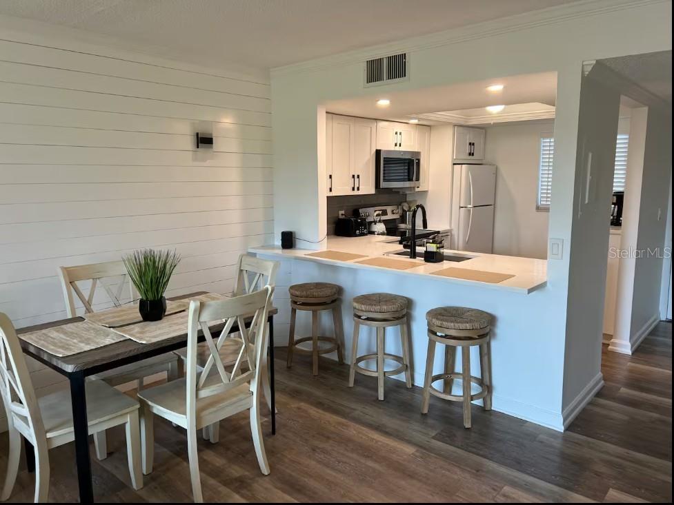 3700 South Beneva Road, Unit 604 Sarasota, FL 34232 - Photo 3 of 10 a dining room with furniture and a floor to ceiling window