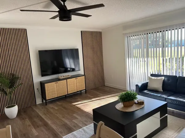 a kitchen with refrigerator a sink and cabinets