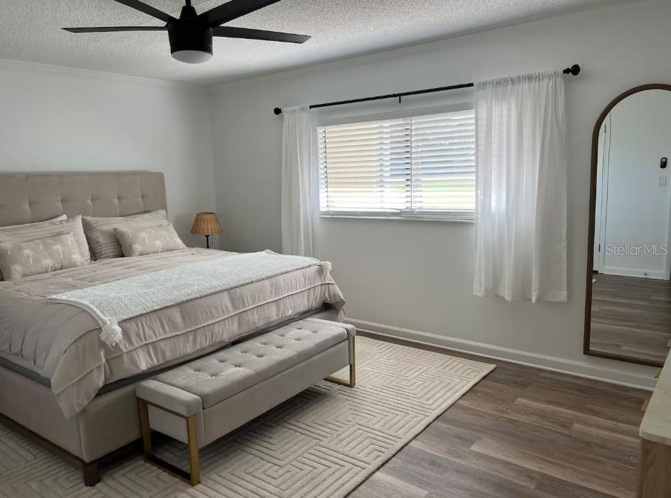3700 South Beneva Road, Unit 604 Sarasota, FL 34232 - Photo 8 of 10 a bedroom with a bed and a window