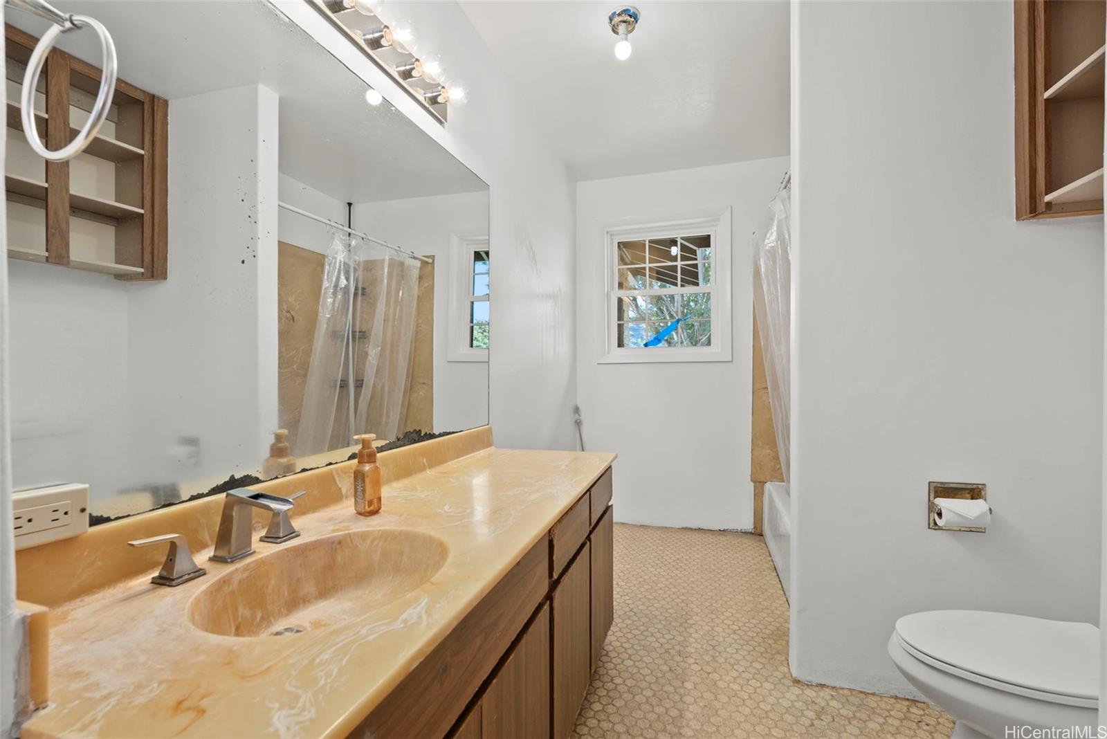 87-1087 Apuupuu Road Waianae, HI 96792 - Photo 12 of 25 a bathroom with a sink and a mirror