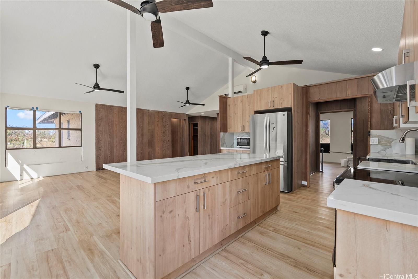 87-1087 Apuupuu Road Waianae, HI 96792 - Photo 6 of 25 a large kitchen with cabinets stove top oven and sink