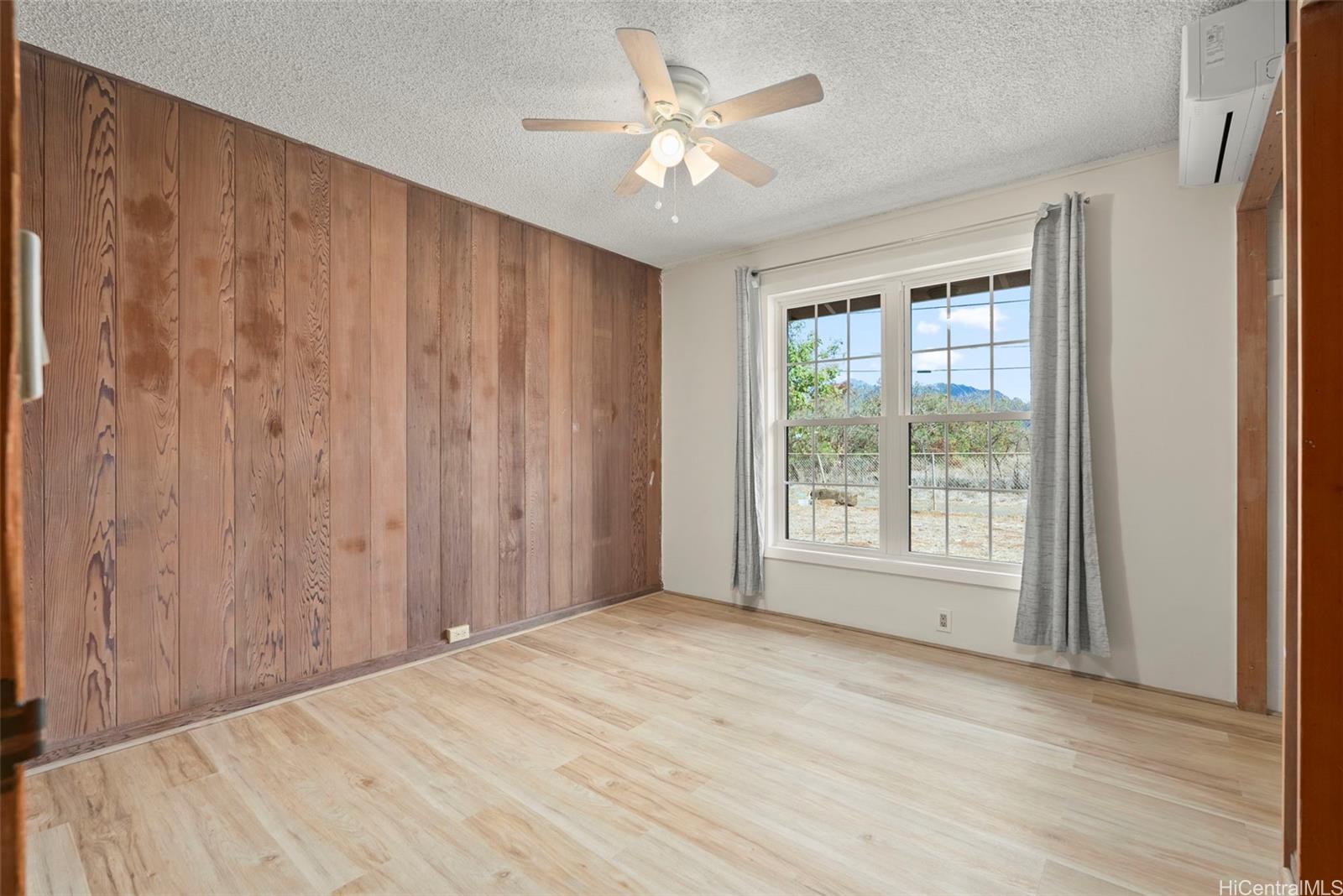 87-1087 Apuupuu Road Waianae, HI 96792 - Photo 10 of 25 a view of an empty room with a window and a kitchen
