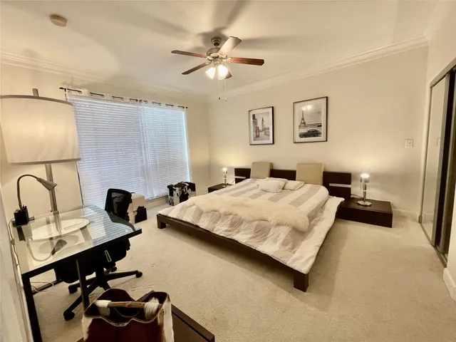 a bedroom with a bed and a dresser