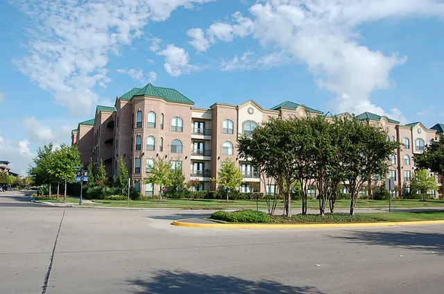 a view of a building with a yard